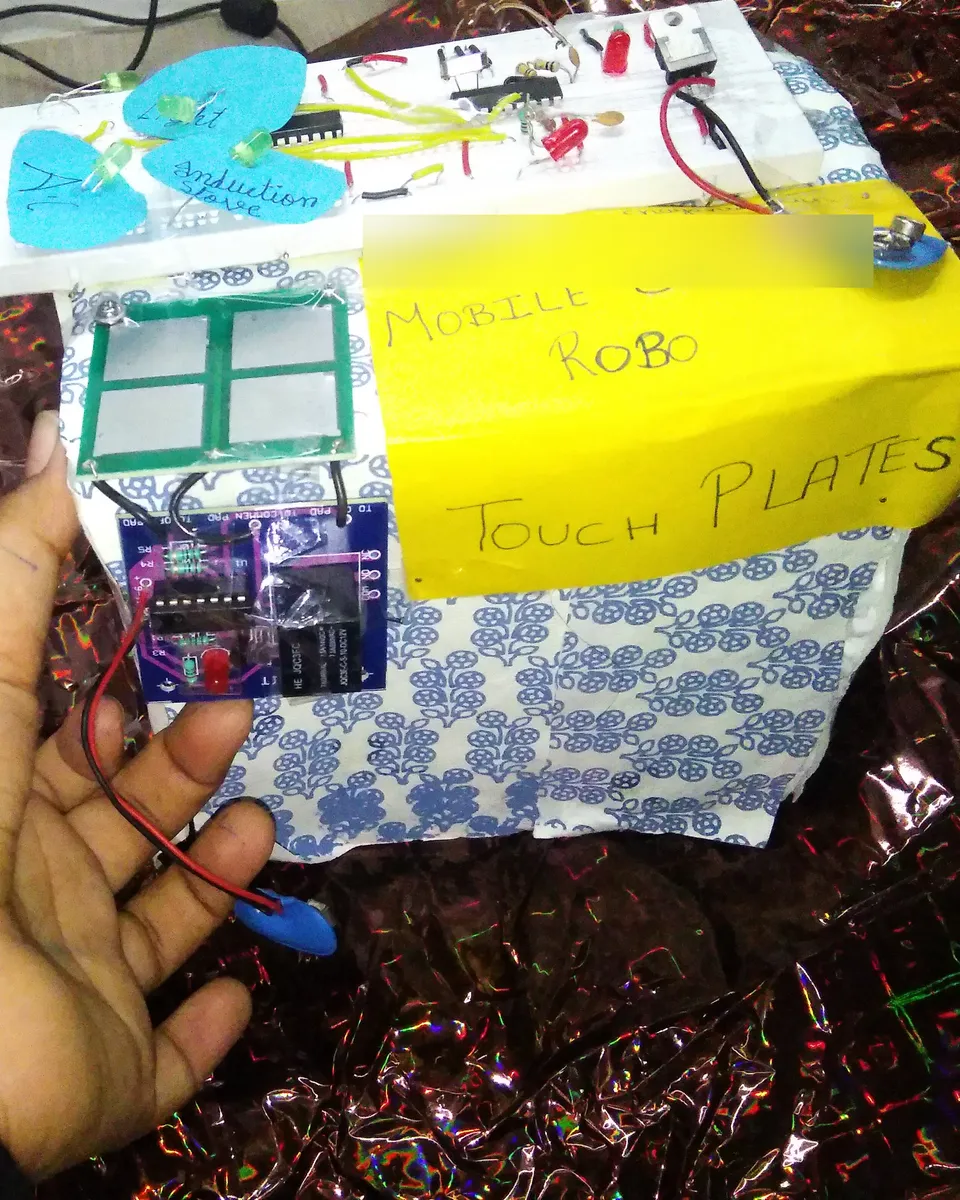 The touch plates and their relay board, held in my hand.