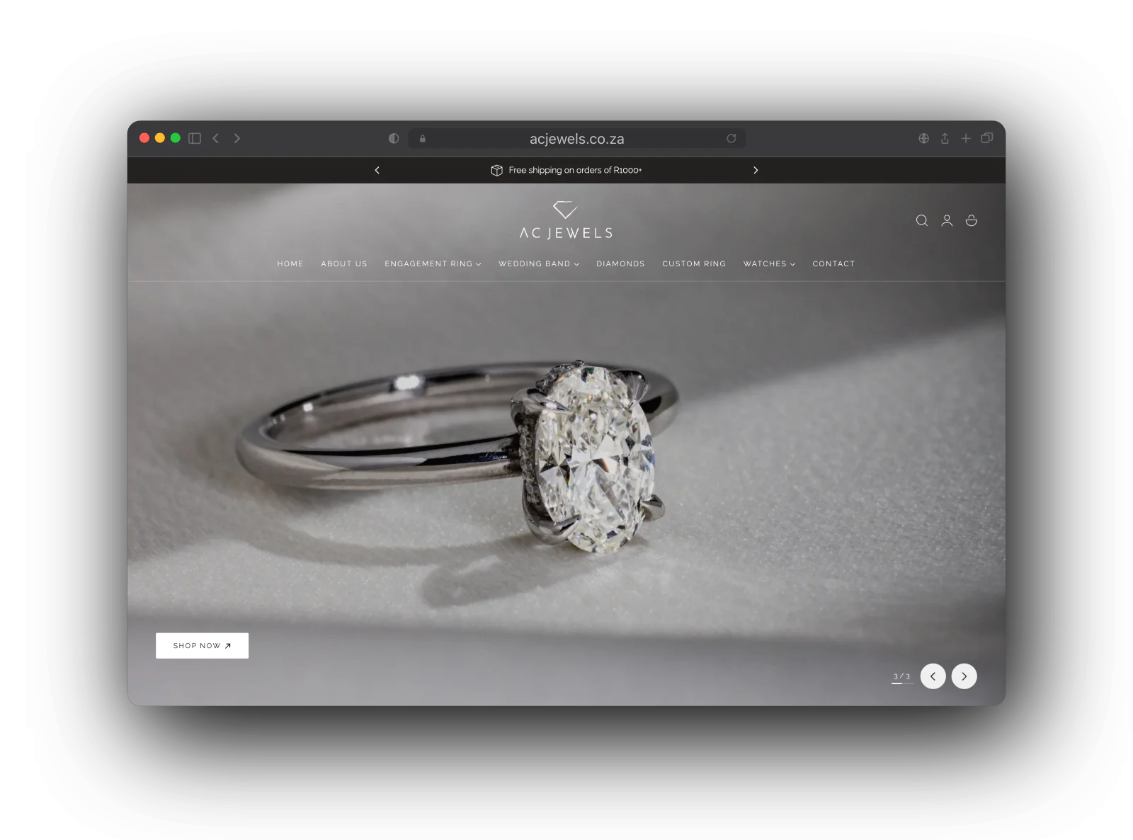 The AC Jewels home page: an oval diamond solitaire on the desktop hero and a gold pear halo ring on the phone, under the AC Jewels logo and menu.